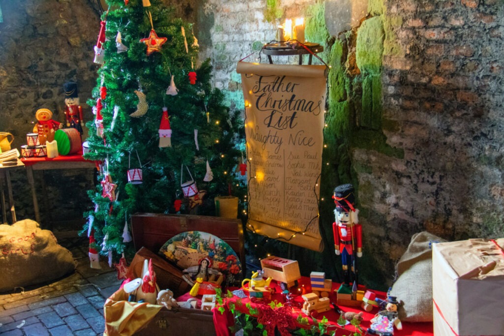the naughty and nice list by christmas tree
